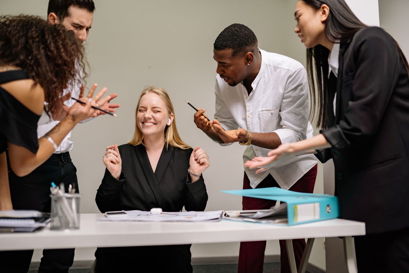 Diverse professionals collaborating in a leadership meeting