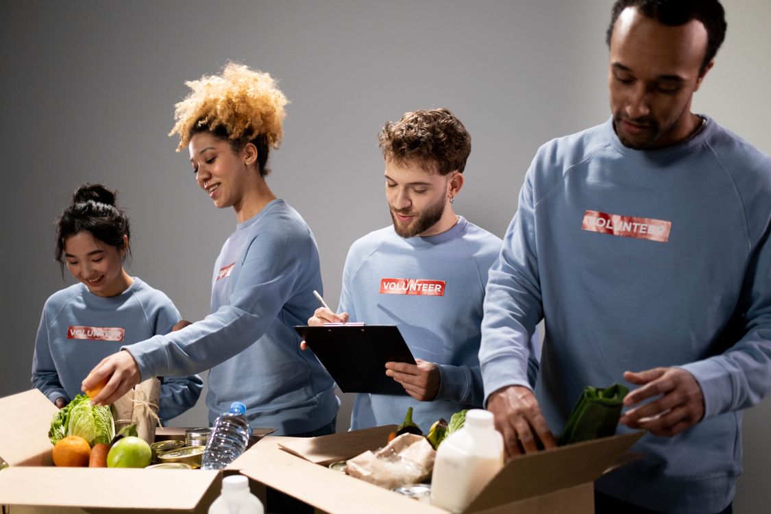 Diverse volunteers preparing community supplies